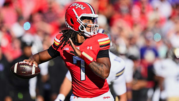 Maryland Terrapins quarterback Malik Washington throws a pass against the Washington Huskies.