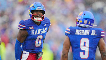 Kansas football seniors Jalon Daniels (6) and Daniel Hishaw Jr. (9)