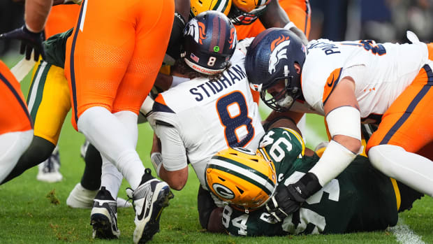 Denver Broncos quarterback Jarrett Stidham (8) is sacked by Green Bay Packers defensive end Karl Brooks (94). 