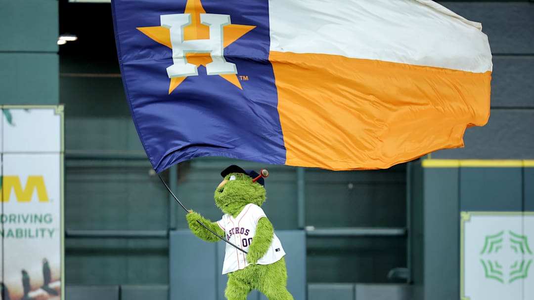May 22, 2025; Houston, Texas, USA; Houston Astros mascot Orbit waves a flag in center field after the final out  against the Seattle Mariners during the ninth inning at Daikin Park. Mandatory Credit: Erik Williams-Imagn Images