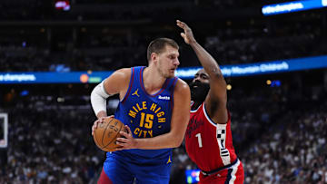May 3, 2025; Denver, Colorado, USA; LA Clippers guard James Harden (1) defends on Denver Nuggets center Nikola Jokic (15) in the third quarter during game seven of first round for the 2025 NBA Playoffs at Ball Arena. Mandatory Credit: Ron Chenoy-Imagn Images