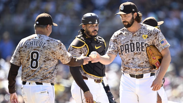 Jul 7, 2024; San Diego, California, USA; San Diego Padres manager Mike Shildt (8) takes the ball from relief pitcher Austin Davis (48) during a pitching change in the ninth inning against the Arizona Diamondbacks at Petco Park. Mandatory Credit: Orlando Ramirez-USA TODAY Sports