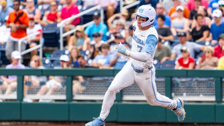 Jun 18, 2024; Omaha, NE, USA; North Carolina Tar Heels center fielder Vance Honeycutt (7) runs after hitting a double against the Florida State Seminoles during the third inning at Charles Schwab Field Omaha. Mandatory Credit: Dylan Widger-USA TODAY Sports