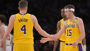 Los Angeles Lakers guard Dalton Knecht (4) and guard Austin Reaves (15) on the court in the first half against the Denver Nuggets at Crypto.com Arena.
