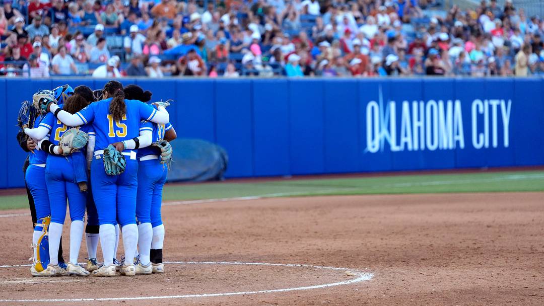 UCLA huddle during a Women's College World Series softball game between Texas Tech Red Raiders and the UCLA Bruins at Devon Park in Oklahoma City, May 31, 2026.