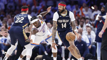 Apr 21, 2024; Oklahoma City, Oklahoma, USA; New Orleans Pelicans forward Brandon Ingram (14) drives around Oklahoma City Thunder guard Luguentz Dort (5) during the fourth quarter of game one of the first round for the 2024 NBA playoffs at Paycom Center.