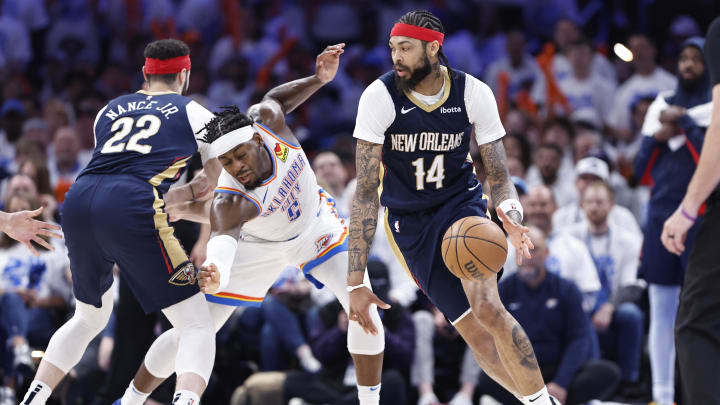 Apr 21, 2024; Oklahoma City, Oklahoma, USA; New Orleans Pelicans forward Brandon Ingram (14) drives around Oklahoma City Thunder guard Luguentz Dort (5) during the fourth quarter of game one of the first round for the 2024 NBA playoffs at Paycom Center. Mandatory Credit: Alonzo Adams-USA TODAY Sports