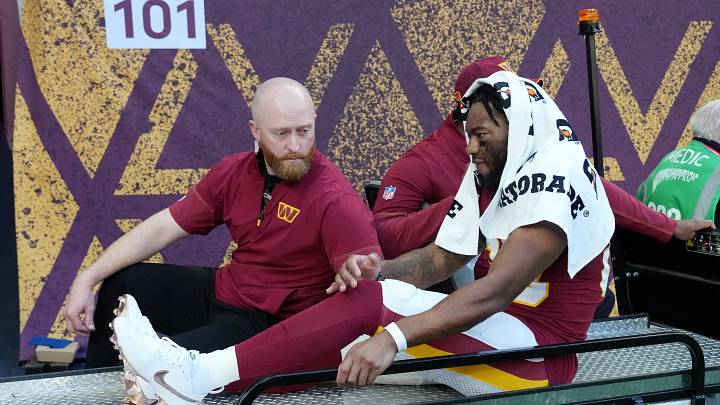 Oct 4, 2026; Tottenham, ENG;  Washington Commanders wide receiver Jaylin Lane (83) is carted off the field after an apparent injury during the third quarter of the game against the Indianapolis Colts at Tottenham Hotspur Stadium.  Mandatory Credit: Kirby Lee-Imagn Images
