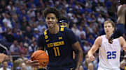 Mar 1, 2025; Provo, Utah, USA; West Virginia Mountaineers guard Jonathan Powell reacts after a rebound against the Brigham Young Cougars during the first half at Marriott Center. Mandatory Credit: Rob Gray-Imagn Images
