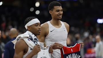 Jan 20, 2024; Washington, District of Columbia, USA; Washington Wizards guard Bilal Coulibaly (L) and San Antonio Spurs center Victor Wembanyama (R) swap jerseys after their game at Capital One Arena. Mandatory Credit: Geoff Burke-Imagn Images