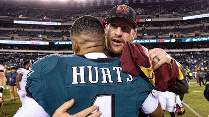 Nov 14, 2022; Philadelphia, Pennsylvania, USA; Philadelphia Eagles quarterback Jalen Hurts (1) hugs Washington Commanders injured quarterback Carson Wentz after the game at Lincoln Financial Field. Mandatory Credit: Bill Streicher-Imagn Images Nov 14, 2022; Philadelphia, Pennsylvania, USA; Philadelphia Eagles quarterback Jalen Hurts (1) hugs Washington Commanders injured quarterback Carson Wentz after the game at Lincoln Financial Field. Mandatory Credit: Bill Streicher-Imagn Images