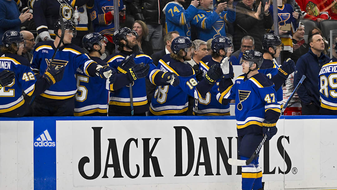 Apr 10, 2024; St. Louis, Missouri, USA;  St. Louis Blues defenseman Torey Krug (47) is congratulated by teammates after scoring against the Chicago Blackhawks during the first period at Enterprise Center. Mandatory Credit: Jeff Curry-Imagn Images