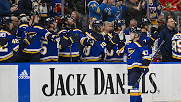 Apr 10, 2024; St. Louis, Missouri, USA;  St. Louis Blues defenseman Torey Krug (47) is congratulated by teammates after scoring against the Chicago Blackhawks during the first period at Enterprise Center. Mandatory Credit: Jeff Curry-Imagn Images