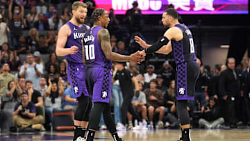 Apr 11, 2025; Sacramento, California, USA; Sacramento Kings forward DeMar DeRozan (10) talks with forward Domantas Sabonis (left) and guard Zach LaVine (8) during the fourth quarter against the Los Angeles Clippers at Golden 1 Center. Mandatory Credit: Darren Yamashita-Imagn Images