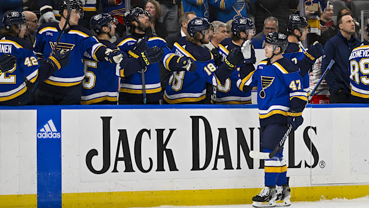 Apr 10, 2024; St. Louis, Missouri, USA;  St. Louis Blues defenseman Torey Krug (47) is congratulated by teammates after scoring against the Chicago Blackhawks during the first period at Enterprise Center. Mandatory Credit: Jeff Curry-Imagn Images