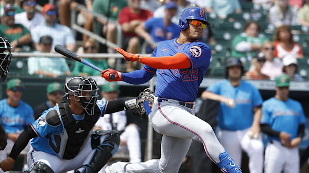 New York Mets right fielder Juan Soto (22) follows through on his swing during a game against the Miami Marlins.