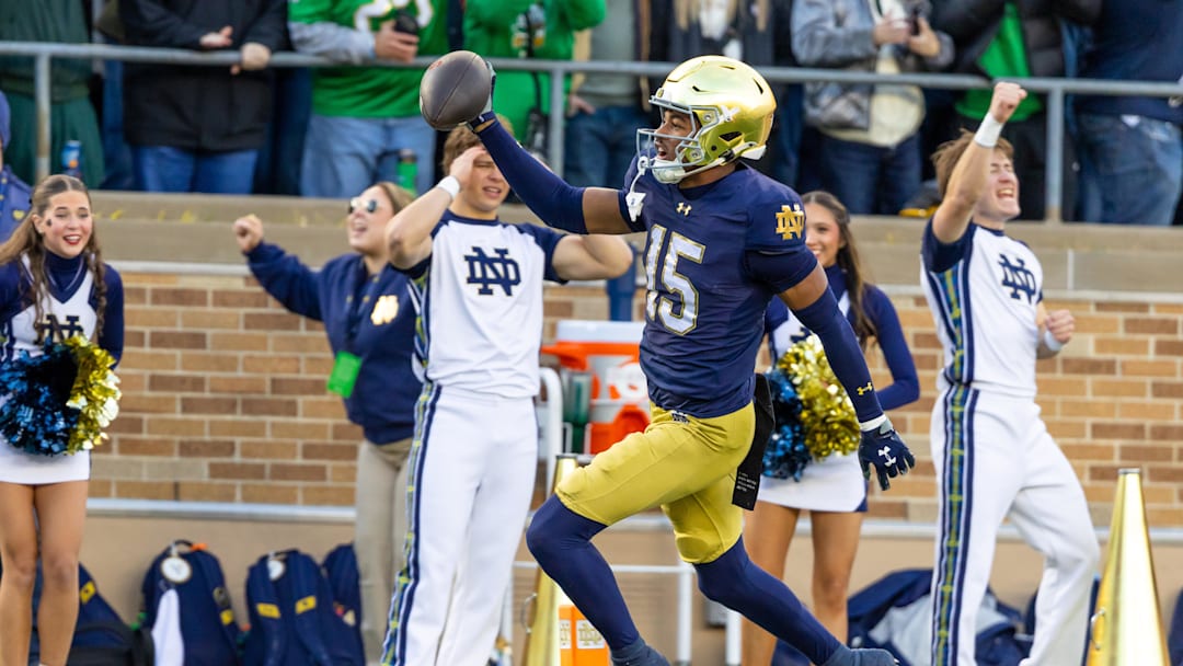 Nov 22, 2025; South Bend, Indiana, USA; Notre Dame Fighting Irish cornerback Leonard Moore (15) returns an interception for a touchdown against the Syracuse Orange during the first half at Notre Dame Stadium. Mandatory Credit: Michael Caterina-Imagn Images Nov 22, 2025; South Bend, Indiana, USA; Notre Dame Fighting Irish cornerback Leonard Moore (15) returns an interception for a touchdown against the Syracuse Orange during the first half at Notre Dame Stadium. Mandatory Credit: Michael Caterina-Imagn Images