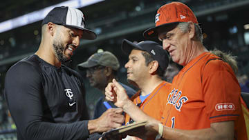 May 31, 2024; Houston, Texas, USA; Minnesota Twins shortstop Carlos Correa (4) signs autographs before the game against the Houston Astros at Minute Maid Park. Mandatory Credit: Troy Taormina-Imagn Images