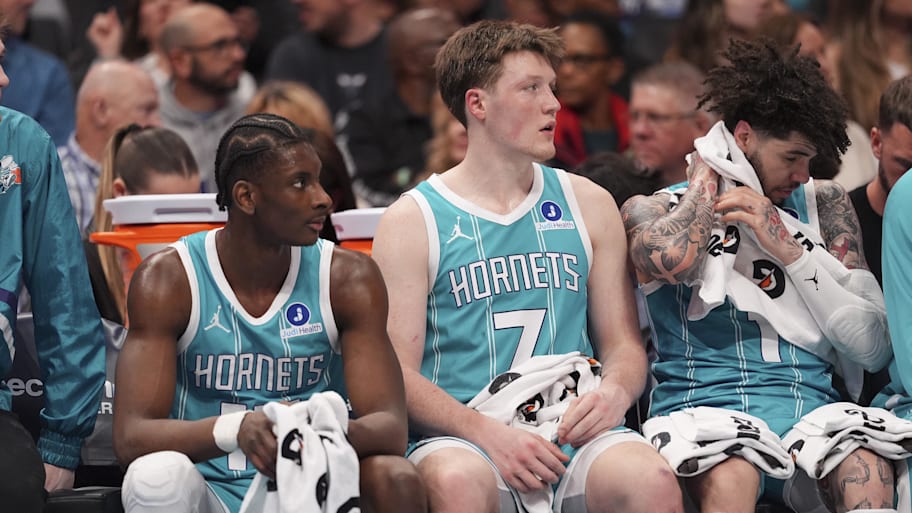 Charlotte Hornets Moussa Diabaté, Kon Knueppel and LaMelo Ball on the bench against the Detroit Pistons.