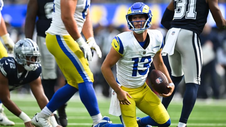 Aug 11, 2024; Inglewood, California, USA; Los Angeles Rams quarterback Stetson Bennett (13) stands up after getting sacked against the Dallas Cowboys during the fourth quarter at SoFi Stadium. Mandatory Credit: Jonathan Hui-USA TODAY Sports