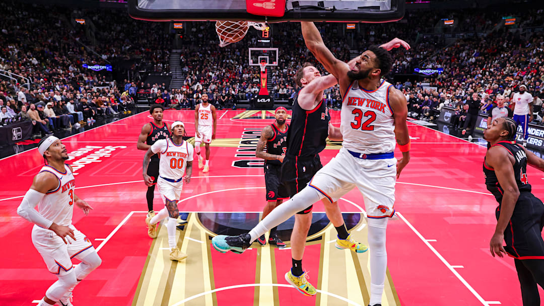 Karl-Anthony Towns drives past Jakob Poeltl 