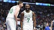 Jaylen Brown, right,  celebrates with Celtics center Luke Kornet 