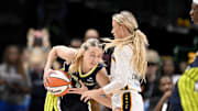 Aug 1, 2025; Dallas, Texas, USA;  Dallas Wings guard Paige Bueckers (5) collides with Indiana Fever guard Sophie Cunningham (8) during the second half at the American Airlines Center. Mandatory Credit: Jerome Miron-Imagn Images