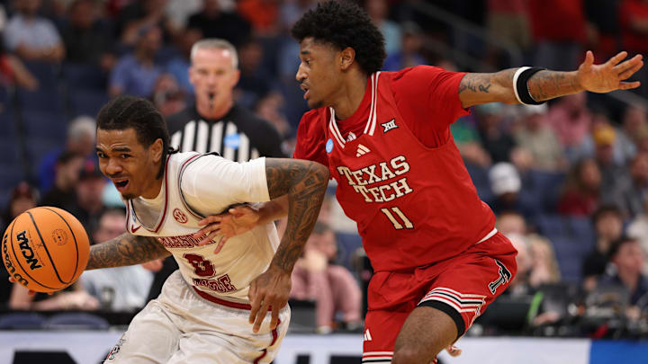 Mar 22, 2026; Tampa, FL, USA; Alabama Crimson Tide guard Labaron Philon (0) dribbles the ball against Texas Tech Red Raiders guard Jaylen Petty (11) in the second half during a second round game of the men's 2026 NCAA Tournament at Benchmark International Arena. Mandatory Credit: Nathan Ray Seebeck-Imagn Images