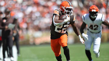 Sep 7, 2025; Cleveland, Ohio, USA; Cleveland Browns running back Dylan Sampson (22) runs against Cincinnati Bengals linebacker Oren Burks (42) during the first half at Huntington Bank Field. Mandatory Credit: Scott Galvin-Imagn Images