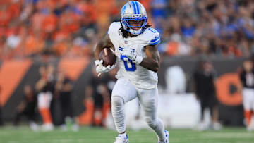 Oct 5, 2025; Cincinnati, Ohio, USA; Detroit Lions running back Jahmyr Gibbs (0) runs for a gain during the fourth quarter against the Cincinnati Bengals at Paycor Stadium. 