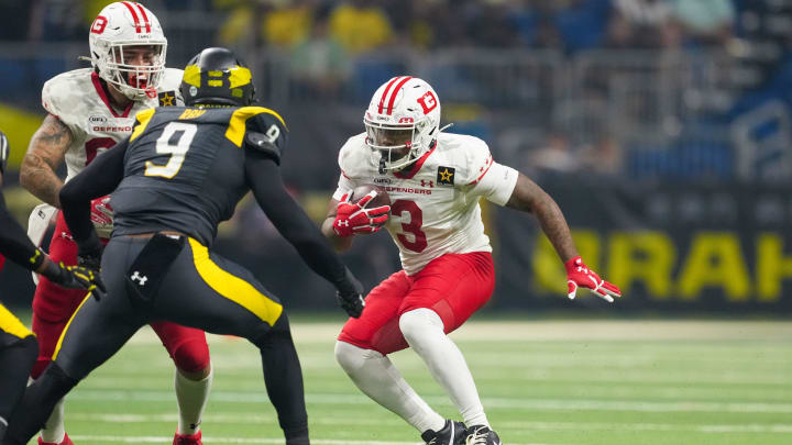 Mar 31, 2024; San Antonio, TX, USA;  DC Defenders running back Cam'Ron Harris (3) runs the ball in front of San Antonio Brahmas linebacker Wyatt Ray (9) in the first half at The Alamodome. Mandatory Credit: Daniel Dunn-USA TODAY Sports