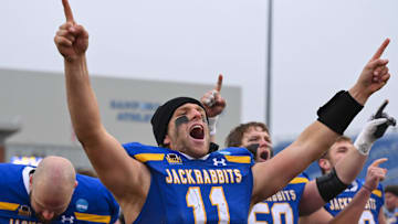 South Dakota State quarterback Mark Gronowski (11) cheers after singing the victory song on Saturday, Dec. 14, 2024, at Dana J. Dykhouse Stadium in Brookings.