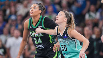 Jul 30, 2025; Minneapolis, Minnesota, USA; New York Liberty guard Sabrina Ionescu (20) and Minnesota Lynx forward Napheesa Collier (24) in the first quarter at Target Center. Mandatory Credit: Brad Rempel-Imagn Images
