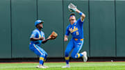Jun 14, 2025; Omaha, Neb, USA; UCLA Bruins center fielder Payton Brennan (11) catches for an out against the Murray State Racers during the sixth inning at Charles Schwab Field. Mandatory Credit: Dylan Widger-Imagn Images