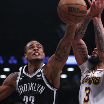 Mar 31, 2024; Brooklyn, New York, USA; Brooklyn Nets center Nic Claxton (33) battles Los Angeles Lakers forward Anthony Davis (3) for the ball during the second half at Barclays Center. Mandatory Credit: Vincent Carchietta-USA TODAY Sports
