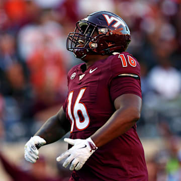 Sep 7, 2024; Blacksburg, Virginia, USA; Virginia Tech Hokies defensive lineman Aeneas Peebles (16) celebrates after a sack during the second quarter against the Marshall Thundering Herd at Lane Stadium. Mandatory Credit: Peter Casey-Imagn Images