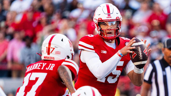 Sep 7, 2024; Lincoln, Nebraska, USA; Nebraska Cornhuskers quarterback Dylan Raiola (15) hands the ball off to wide receiver Jacory Barney Jr. (17) against the Colorado Buffaloes during the first quarter at Memorial Stadium.