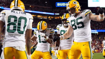 January 20, 2024; Santa Clara, CA, USA; Green Bay Packers wide receiver Dontayvion Wicks (13) and wide receiver Romeo Doubs (87) and tight end Tucker Kraft (85) celebrate after wide receiver Bo Melton (80) scored a touchdown against the San Francisco 49ers during the third quarter in a 2024 NFC divisional round game at Levi's Stadium. Mandatory Credit: Kyle Terada-USA TODAY Sports