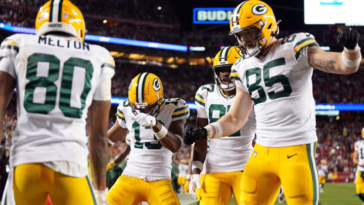 January 20, 2024; Santa Clara, CA, USA; Green Bay Packers wide receiver Dontayvion Wicks (13) and wide receiver Romeo Doubs (87) and tight end Tucker Kraft (85) celebrate after wide receiver Bo Melton (80) scored a touchdown against the San Francisco 49ers during the third quarter in a 2024 NFC divisional round game at Levi's Stadium. Mandatory Credit: Kyle Terada-USA TODAY Sports