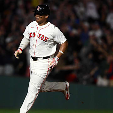 May 17, 2025; Boston, Massachusetts, USA; Boston Red Sox designated hitter Rafael Devers (11) hits a walk off home run against the Atlanta Braves during the ninth inning at Fenway Park. Mandatory Credit: Brian Fluharty-Imagn Images