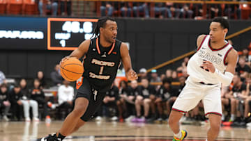Feb 8, 2025; Stockton, California, USA; Pacific Tigers guard Lamar Washington (1) dribbles against Gonzaga Bulldogs guard Nolan Hickman (right) during the first half at Alex G. Spanos Center. Mandatory Credit: Darren Yamashita-Imagn Images