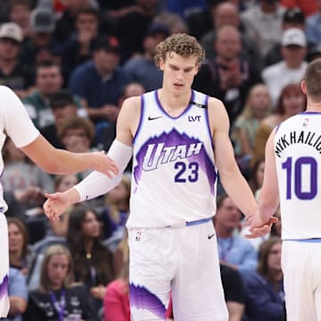 Oct 29, 2025; Salt Lake City, Utah, USA: Utah Jazz forward Lauri Markkanen (23) interacts with center Walker Kessler (24) and guard Svi Mykhailiuk (10) after a basket against the Portland Trail Blazers during the second quarter at Delta Center. Mandatory Credit: Rob Gray-Imagn Images