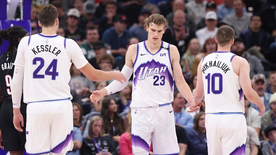 Oct 29, 2025; Salt Lake City, Utah, USA; Utah Jazz forward Lauri Markkanen (23) interacts with center Walker Kessler (24) and guard Svi Mykhailiuk (10) after a basket against the Portland Trail Blazers during the second quarter at Delta Center. Mandatory Credit: Rob Gray-Imagn Images Oct 29, 2025; Salt Lake City, Utah, USA; Utah Jazz forward Lauri Markkanen (23) interacts with center Walker Kessler (24) and guard Svi Mykhailiuk (10) after a basket against the Portland Trail Blazers during the second quarter at Delta Center. Mandatory Credit: Rob Gray-Imagn Images