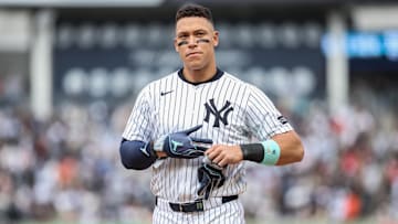 New York Yankees right fielder Aaron Judge (99) heads back to the field after getting stranded on first base in the seventh inning against the San Francisco Giants at Yankee Stadium.