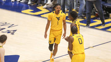 Nov 13, 2025; Morgantown, West Virginia, USA; West Virginia Mountaineers guard Jasper Floyd (1) celebrates with West Virginia Mountaineers guard Honor Huff (3) during the second half against the Pittsburgh Panthers at WVU Coliseum. Mandatory Credit: Ben Queen-Imagn Images