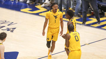 Nov 13, 2025; Morgantown, West Virginia, USA; West Virginia Mountaineers guard Jasper Floyd (1) celebrates with West Virginia Mountaineers guard Honor Huff (3) during the second half against the Pittsburgh Panthers at WVU Coliseum. Mandatory Credit: Ben Queen-Imagn Images
