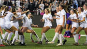 Noblesville Millers celebrate defeating the Bloomington South Panthers on Saturday, Oct. 28, 2023, during the IHSAA girls soccer Class 3A state championship at Michael Carroll Track & Soccer Stadium in Indianapolis. The Noblesville Millers defeated the Bloomington South Panthers, 3-1.