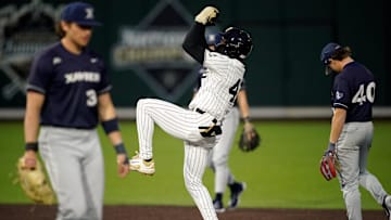 Vanderbilt center fielder RJ Austin (42) celebrates his two RBI double against Xavier during the fourth inning at Hawkins Field in Nashville, Tenn., Friday, March 7, 2025. Vanderbilt won 15-3 in seven innings.