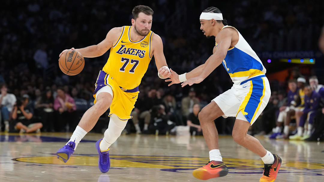 Mar 6, 2026; Los Angeles, California, USA; Los Angeles Lakers guard Luka Doncic (77) dribbles against Indiana Pacers guard Andrew Nembhard (2) in the first half at Crypto.com Arena. Mandatory Credit: Kirby Lee-Imagn Images
