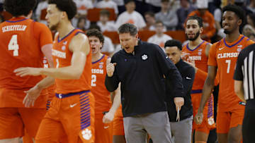 Mar 1, 2025; Charlottesville, Virginia, USA; Clemson Tigers head coach Brad Brownell (center) celebrates with players on the court during the second half against the Virginia Cavaliers at John Paul Jones Arena. Mandatory Credit: Amber Searls-Imagn Images